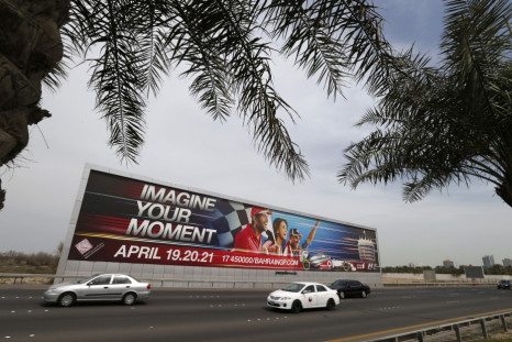 Vehicles travel past a large Bahrain Formula One advertising billboard on main highway leading to Bahrain Internaitonal Circuit