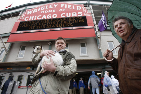 Chicago Cubs fans Charlie Thomas (L) and Eddie Weingartner stand outside Wrigley Field