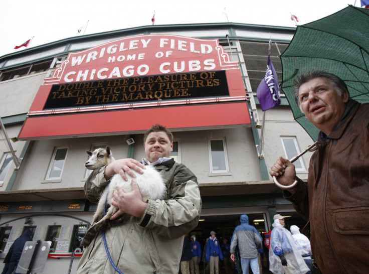 Chicago Cubs fans Charlie Thomas (L) and Eddie Weingartner stand outside Wrigley Field