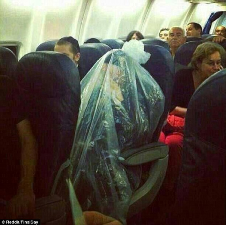 Passenger wraps himself in plastic bag