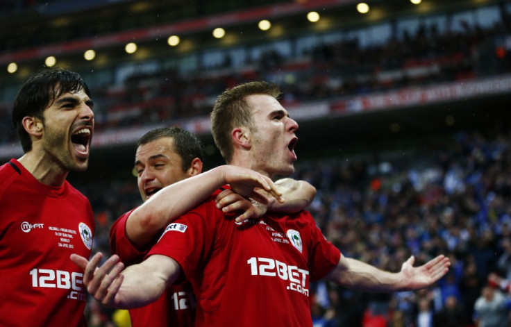 Wigan Athletic's Callum McManaman celebrate's sinking Millwall