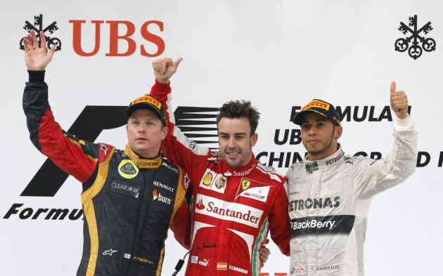 Fernando Alonso, flanked by Kimi Raikkonen (L) and Lewis Hamilton Fernando Alonso, flanked by Kimi Raikkonen (L) and Lewis Hamilton