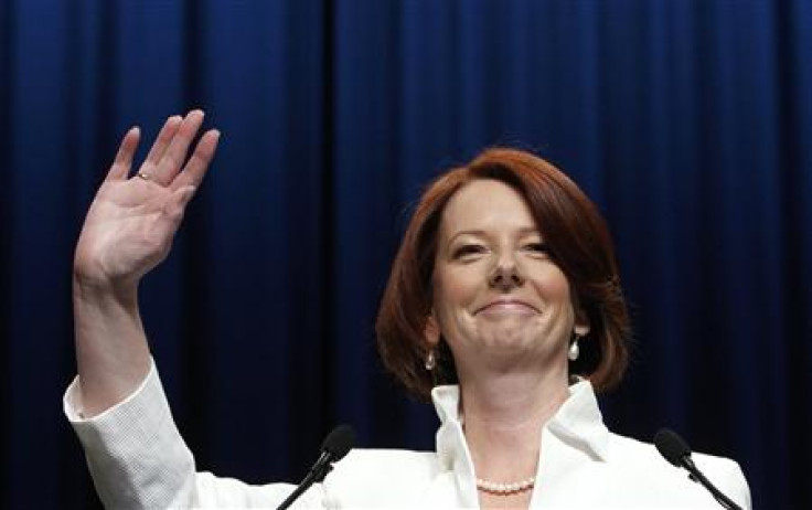 Australian Prime Minister Julia Gillard waves to supporters at the Labor Party election headquarters in Melbourne