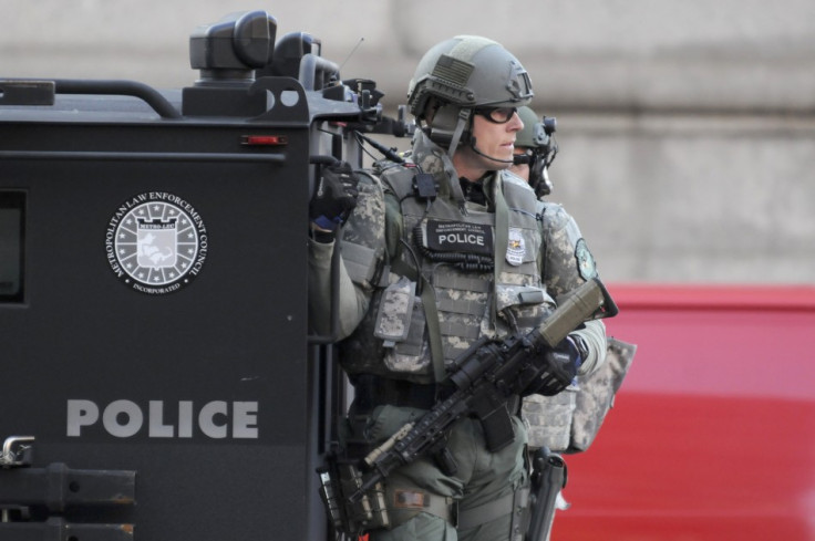 SWAT officers patrol the Copley Square area after explosions near the finish line of the Boston Marathon in Boston,