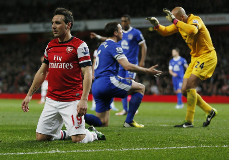 Arsenal's Santi Cazorla reacts after an unsuccessful attempt scoring attempt past Everton goal keeper Tim Howard (R) during the English Premier League match at Emirates Stadium in north London April 16, 2013