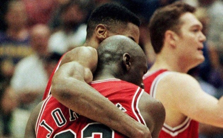 Michael Jordan falls into Scottie Pippen's arms