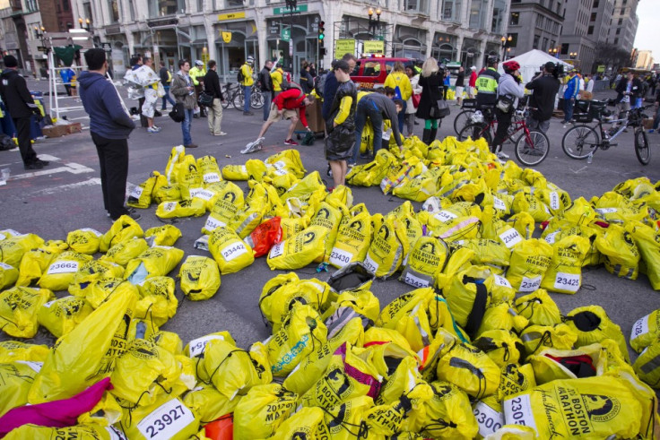 Volunteers organize participants for belongings for collection