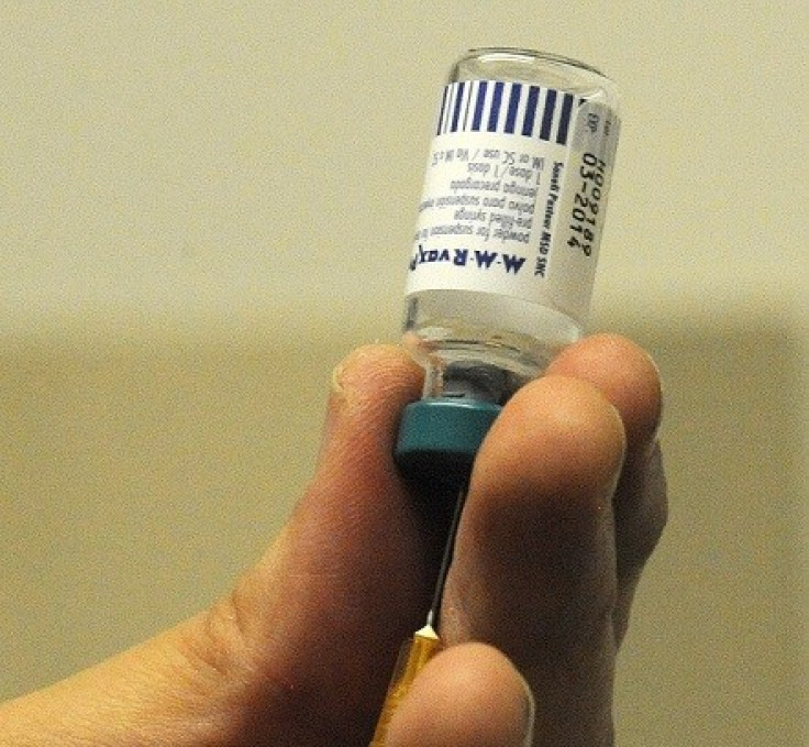 A doctor prepares an MMR injection in the Paediatric Outpatients department at Morriston Hospital in Swansea (Reuters)