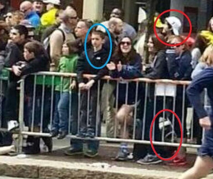 Picture of Tsarnaev standing behind 8-year-old Martin Richard, who died in the Boston blast (Twitter)