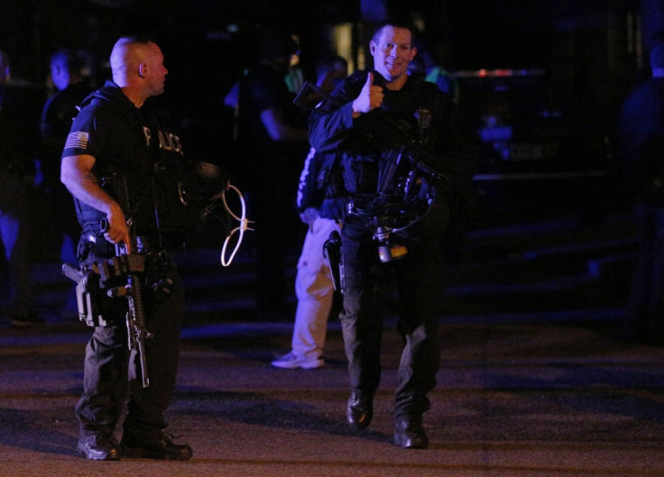 A tactical police officer gives the thumbs-up as he emerges from the site where police captured Dzhokhar Tsarnaev, the surviving suspect in the Boston Marathon bombings