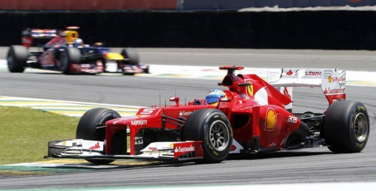 Fernando Alonso (in front) and Sebastian Vettel