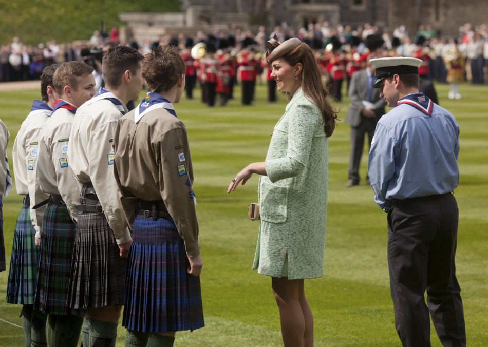 Britains Catherine, Duchess of Cambridge, showing visible signs of pregnancy, meets scouts during at the National Review of Queens Scouts at Windsor Castle in Berkshire, near London April 21, 2013.
