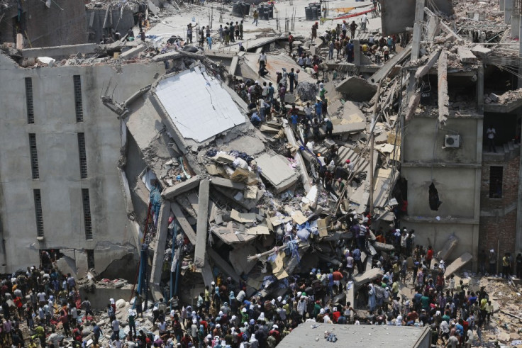 People rescue garment workers trapped under rubble at the Rana Plaza building after it collapsed