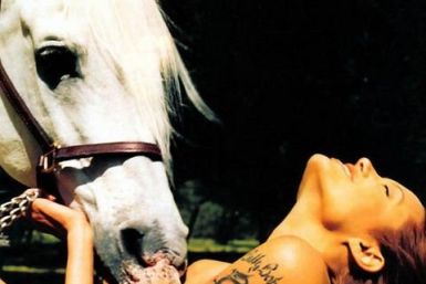 The revealing photograph of a young Angelina Jolie posing with a horse will lead a sale of photographs at London auction house Christie's next month