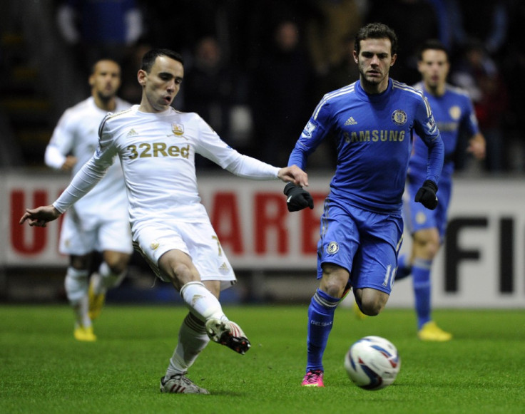 Leon Britton (L) and Juan Mata