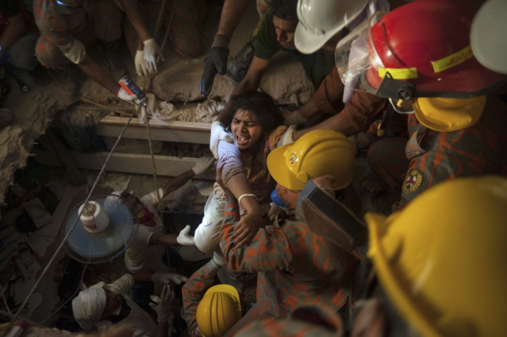 Rescuers pull a survivor from the rubble of the Rana complex (Reuters)