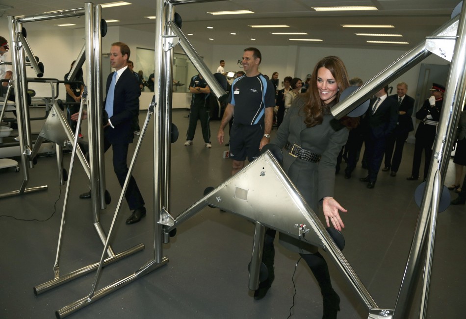 Prince William and his wife Catherine, Duchess of Cambridge play a reaction game in the new gym during the official launch of The Football Associations National Football Centre at St Georges Park in Burton upon Trent, central England October 9