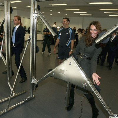 Prince William and his wife Catherine, Duchess of Cambridge play a reaction game in the new gym during the official launch of The Football Association's National Football Centre at St George's Park in Burton upon Trent, central England October 9
