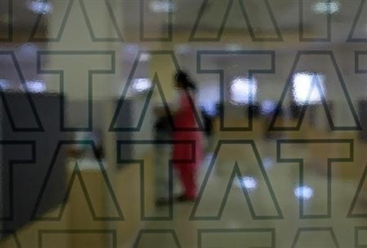 An employee of Tata Consultancy Services (TCS) works inside the company headquarters in Mumbai March 14, 2013.