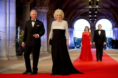 Prince Charles L and his wife Camilla, Duchess of Cornwall, arrive at a gala dinner organised on the eve of the abdication of Queen Beatrix of the Netherlands and the inauguration of her successor King Willem-Alexander at the Rijksmuseum in Amsterdam Ap