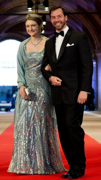 Luxembourgs Hereditary Grand Duke Guillaume R and his wife Princess Stephanie arrive at a gala dinner organised on the eve of the abdication of Queen Beatrix of the Netherlands and the inauguration of her successor King Willem-Alexander at the Rij