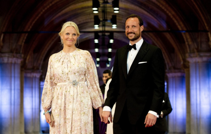 Norway's Crown Princess Mette-Marit and Crown Prince Haakon (R) arrive at a gala dinner organised on the eve of the abdication of Queen Beatrix of the Netherlands and the inauguration of her successor King Willem-Alexander at the Rijksmuseum in Amste