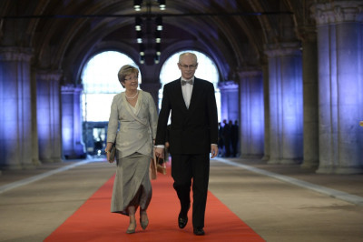 European Council President Herman Van Rompuy R and his wife Geertrui Windels arrive at a gala dinner organised on the eve of the abdication of Queen Beatrix of the Netherlands and the inauguration of her successor King Willem-Alexander at the Rijksmuseu