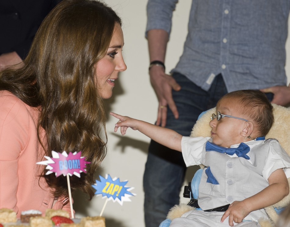 Catherine, Duchess of Cambridge, speaks with a child during her visit to the Naomi House childrens hospice in Sutton Scotney, southern England