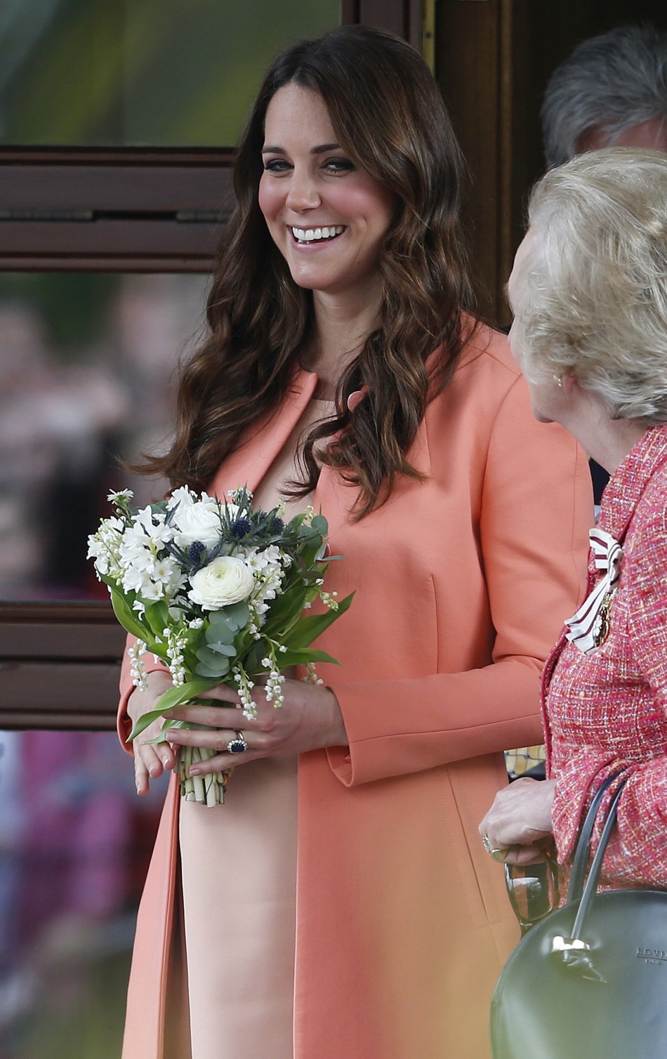 Catherine, Duchess of Cambridge, smiles as she leaves after visiting the Naomi House childrens hospice in Sutton Scotney, southern England
