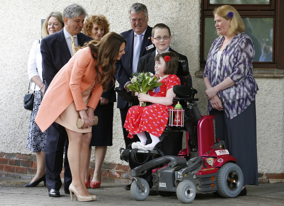 Catherine, Duchess of Cambridge, speaks with Sally Evans, aged 8