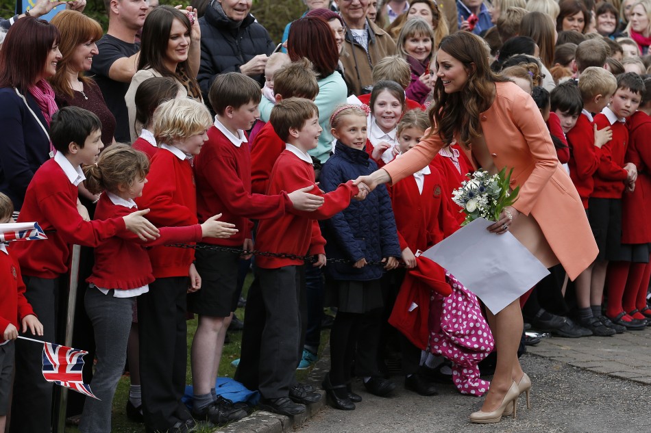 Catherine, Duchess of Cambridge, greets school children as she leaves after visiting the Naomi House childrens hospice in Sutton Scotney, southern England