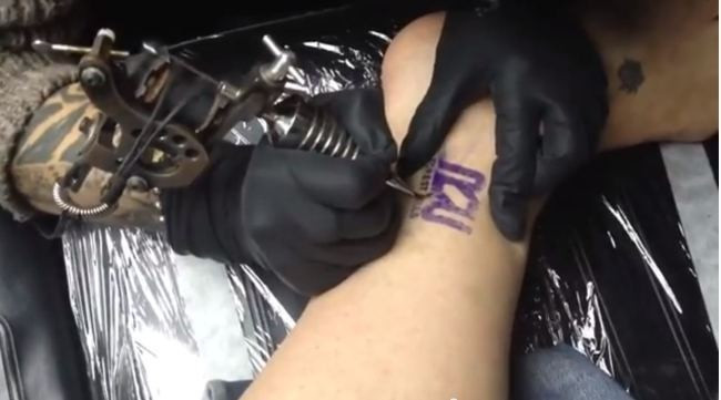 Employees of Rapid Realty offered 15% pay rise if they agree to tattoo of company logo. (Facebook)