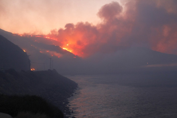 The Springs Fire burns near the Pacific coast highway in California.