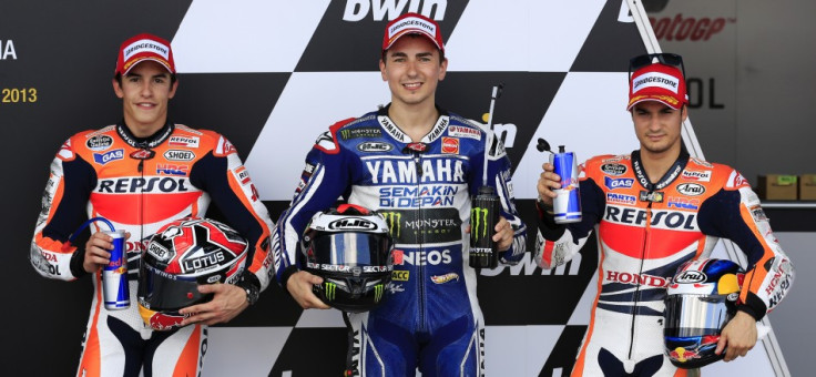 Lorenzo flanked by Marquez (L) and Pedrosa