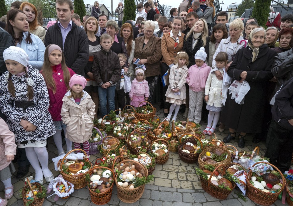 Ukrainian Greek-Catholic believers gather outside a church before an Easter service in Pustomyty village near Lviv May 4, 2013.