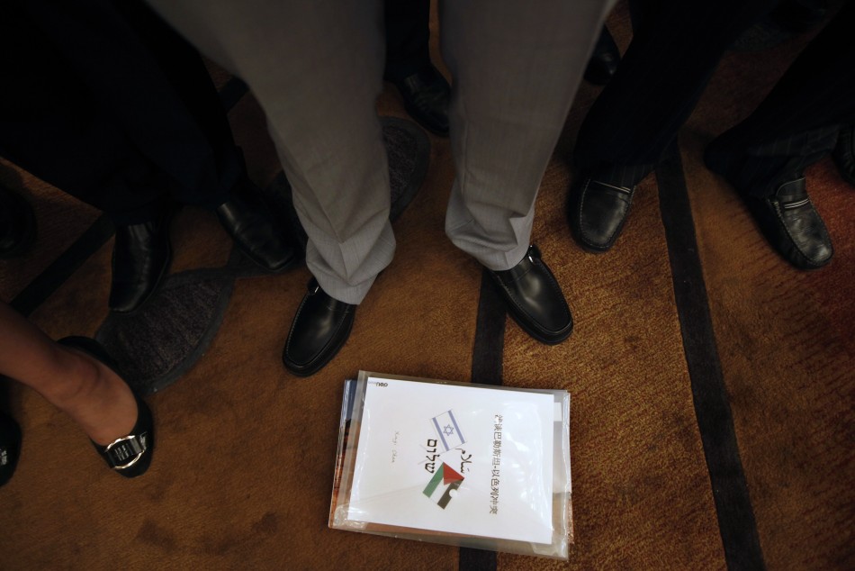 A book about Israeli and Palestinian relations, which is bought along by a Chinese guest, is seen on the floor