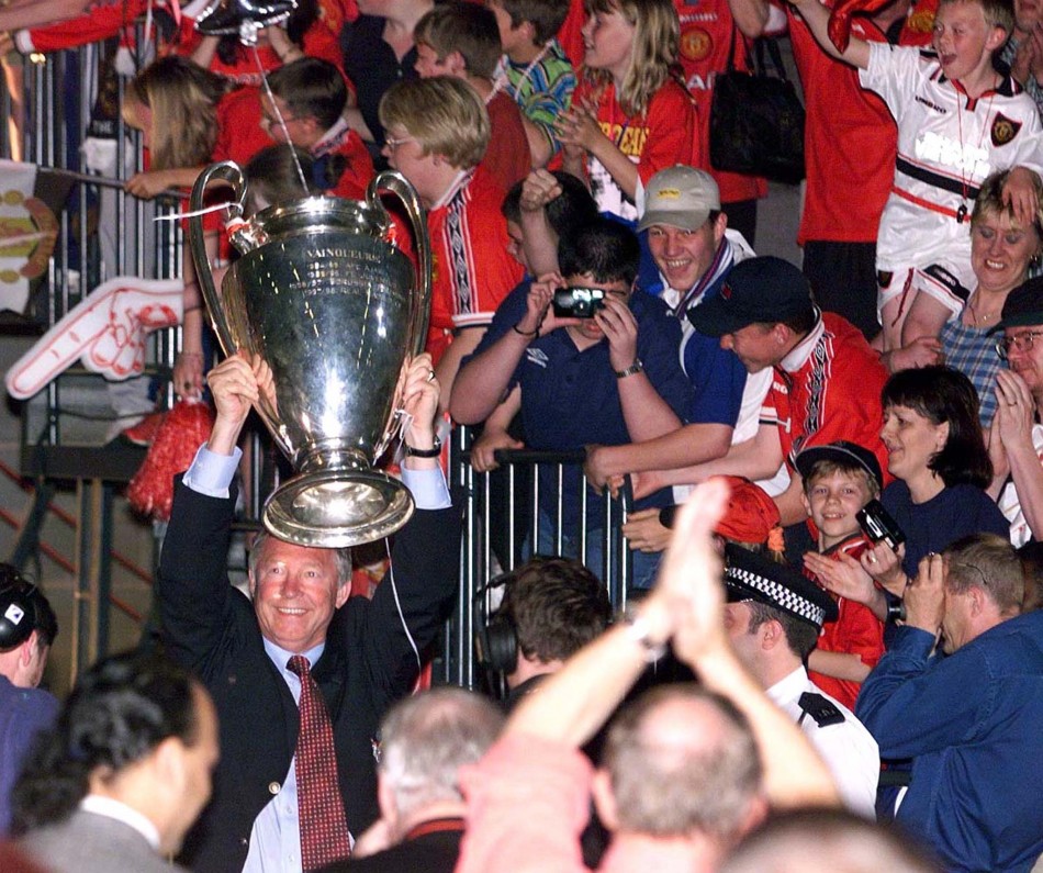 May 27 1999 Ferguson celebrates his first European glory at the MEN Arena in Manchester at the end of their parade of the city. United had won the treble that season the FA cup, Premier league, and the European Cup.