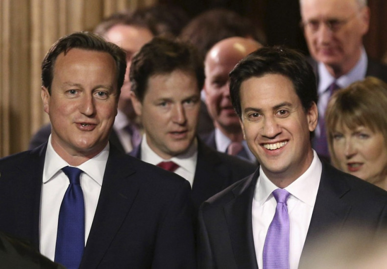 PM Cameron (l) and Labour leader Ed Miliband walk from the Commons to the House of Lords