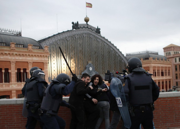 Police charge protesters during an anti-austerity demonstration in Madrid April 25, 2013. Members of a the "Stand up!" platform called on people  to stage an "indefinite siege" around parliament with the objective of "liberating&q