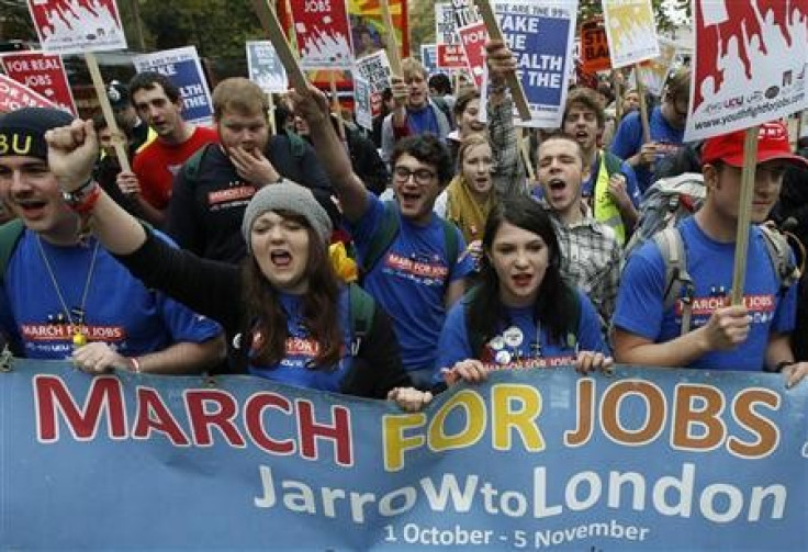 Demonstrators protest against job cuts in central London (Photo: Reuters)