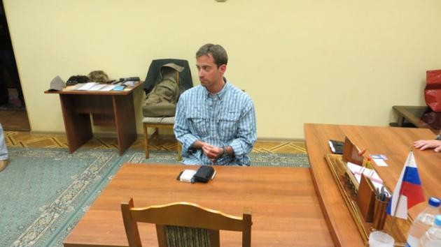 Ryan Folge pictures in what is belied to be the FSB offices (FSB/Russia Today)