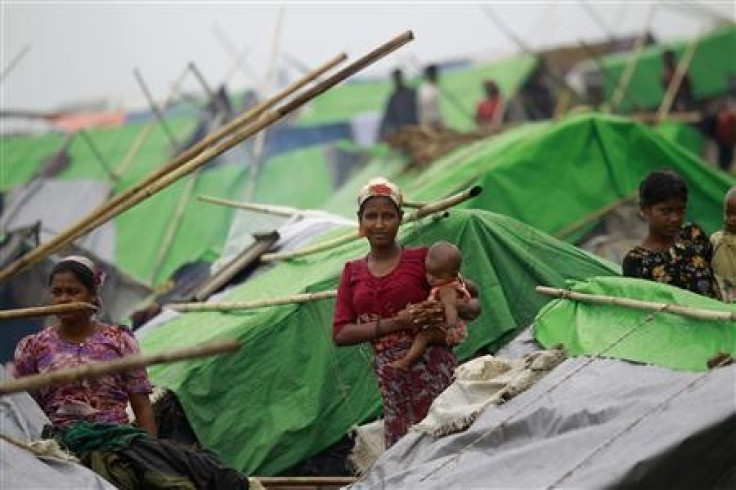 Women pass their time in a Rohingya internally displaced person (IDP) camp outside of Sittw