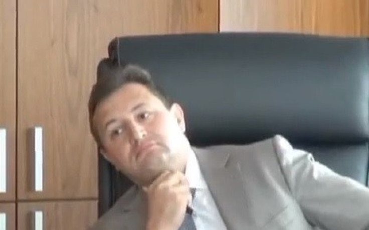 Vladimir Golubkov CEO Rosbank apparently caught in the act by Russia's Interior Ministry in a  (Photo:screengrab from the Euronews footage on YouTube)