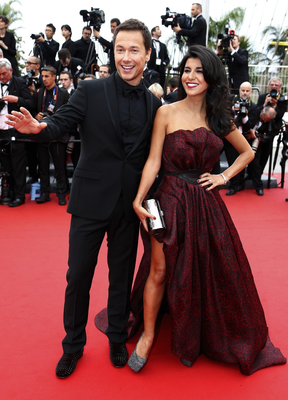 Actor Stephane Rousseau L and actress and director Reem Kherici pose on the red carpet for the screening of the film Jeune  Jolie Young  Beautiful in competition during the 66th Cannes Film Festival in Cannes May 16, 2013.