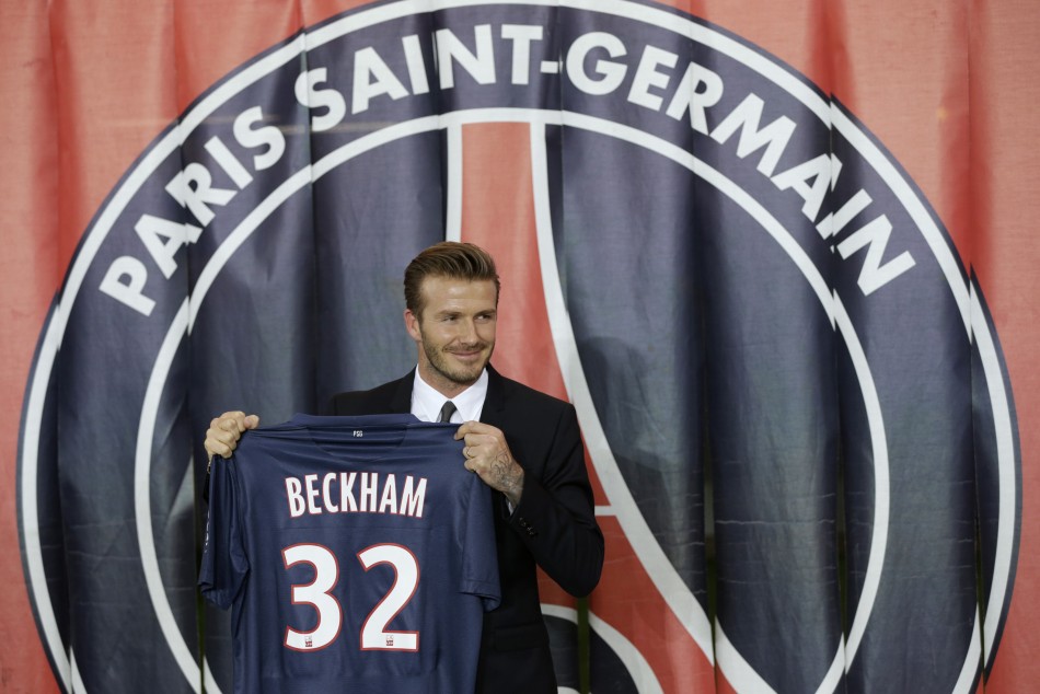 Soccer player David Beckham presents his new jersey after a news conference in Paris January 31, 2013.