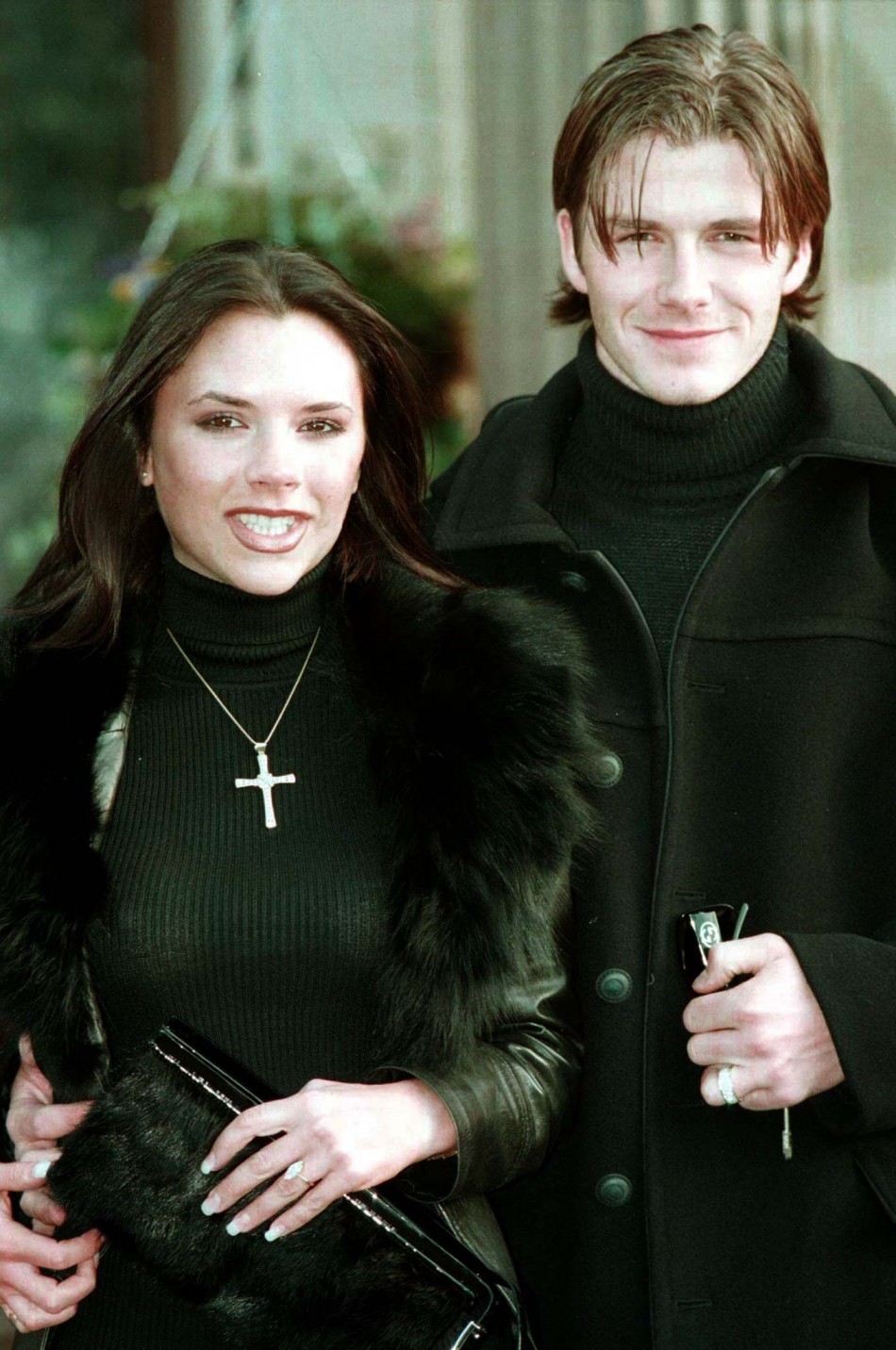Victoria Adams, then a member of the British band The Spice Girls, poses for photographers with her fiancee, Manchester United footballer David Beckham January 25 1998. Beckham and Adams made their engagement public at a luxury hotel after media speculati