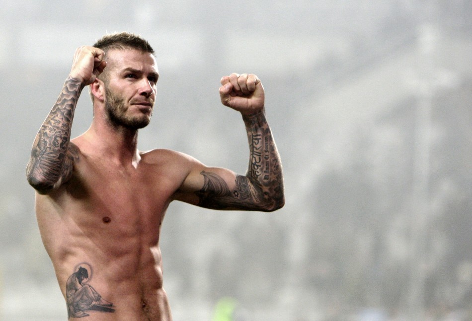 David Beckham celebrates at the end of the match against Juventus during their Serie A soccer match at Olympic stadium in Turin, January 10, 2010.