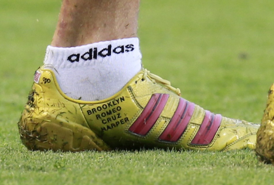 David Beckham of Britain displays the names of his four children on his boot during their MLS soccer match against the San Jose Earthquakes in Carson, California August 20, 2011.