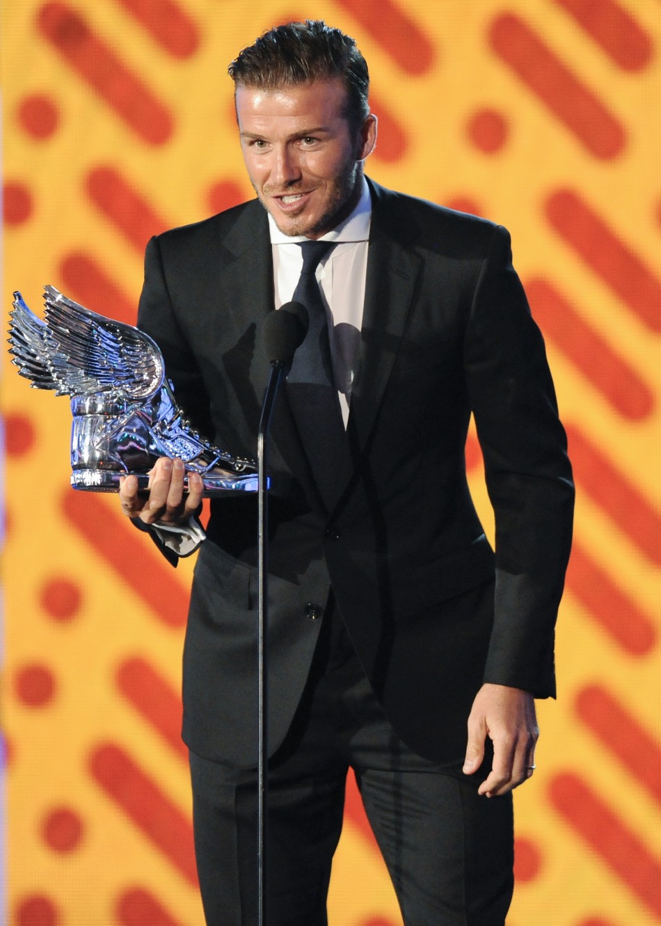 David Beckham accepts the Do Something Athlete award during the Do Something Awards in Los Angeles, California August 14, 2011.
