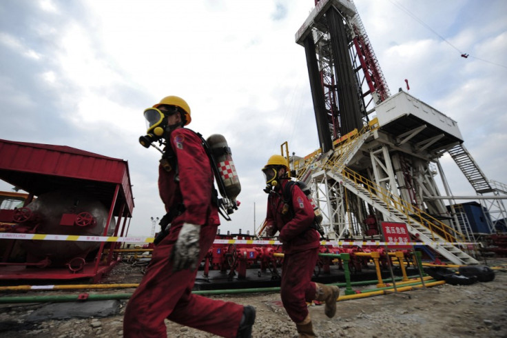 Workers carry out a practice drill in case of a hydrogen sulfide leak at a natural gas appraisal well of Sinopec in Langzhong county, Sichuan province March 1, 2011. China, which has by far the world?s largest shale deposits, has just started to exploit t